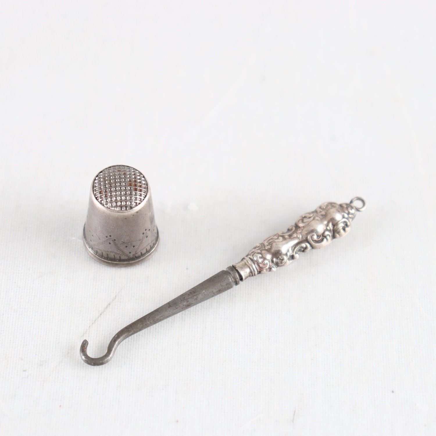 Kängknäppare, skaft i silver, probertestat, fingerborg, silver, Stockholm, 1915