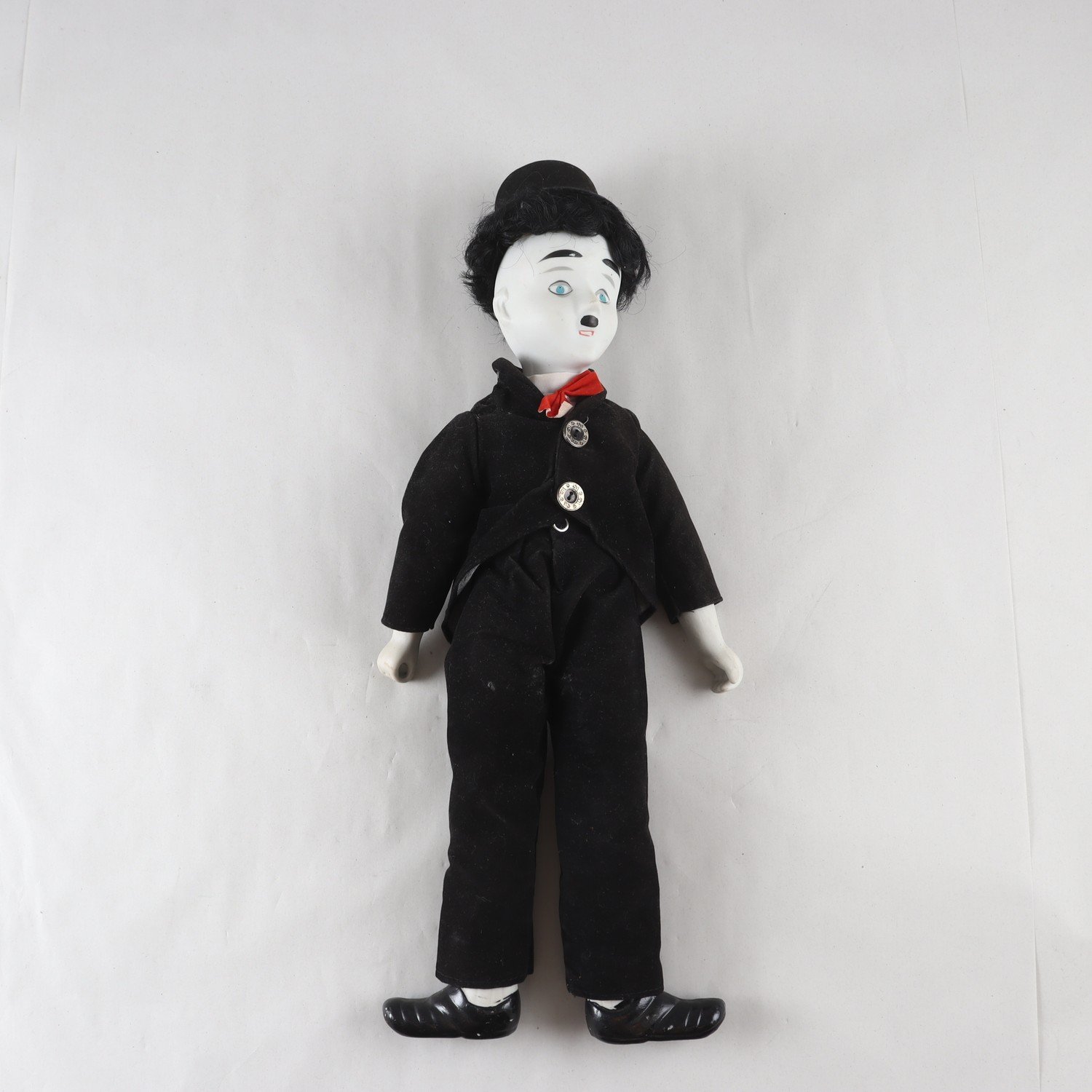 Docka, Charlie chaplin, i porslin. Samfraktas ej.