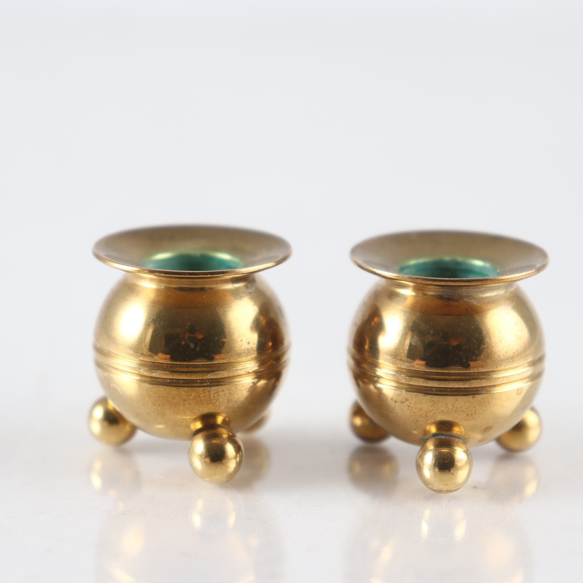 Paret miniatyr kulljusstakar, mässing, Skultuna