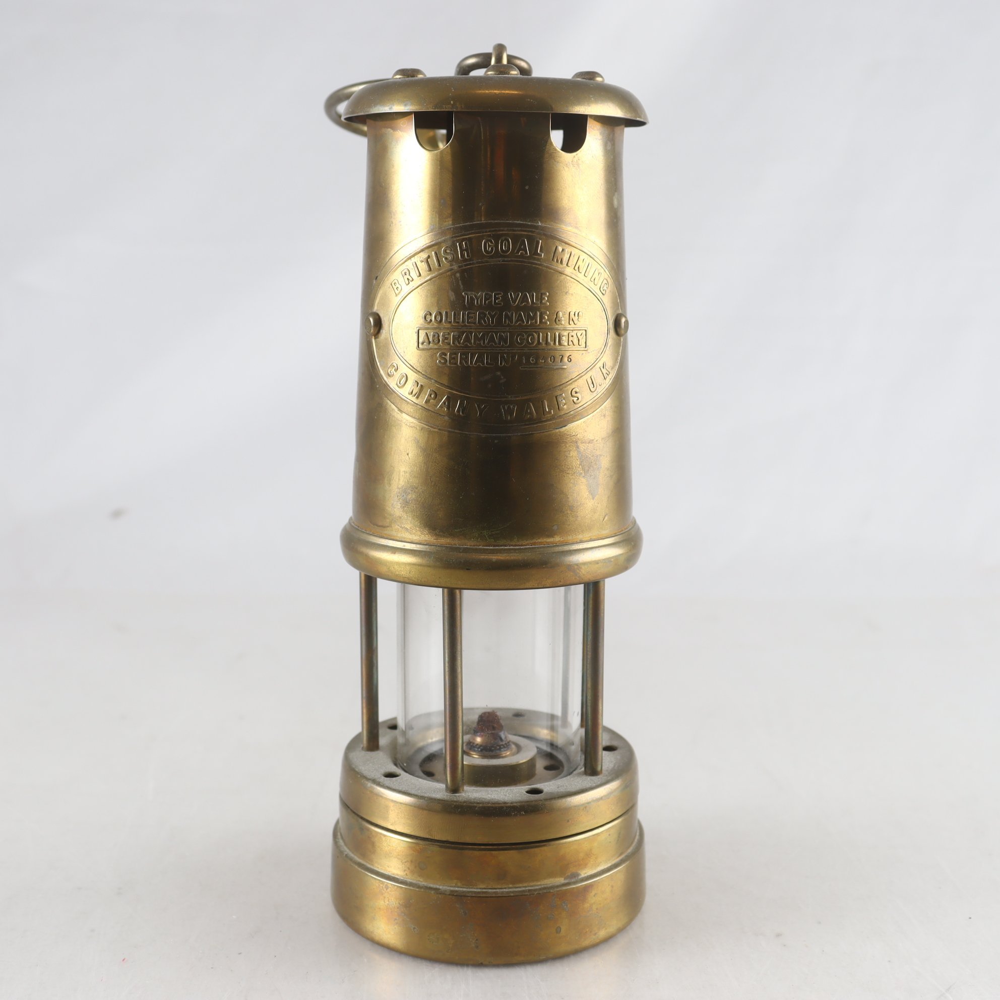 Gruvlykta, mässing & glas