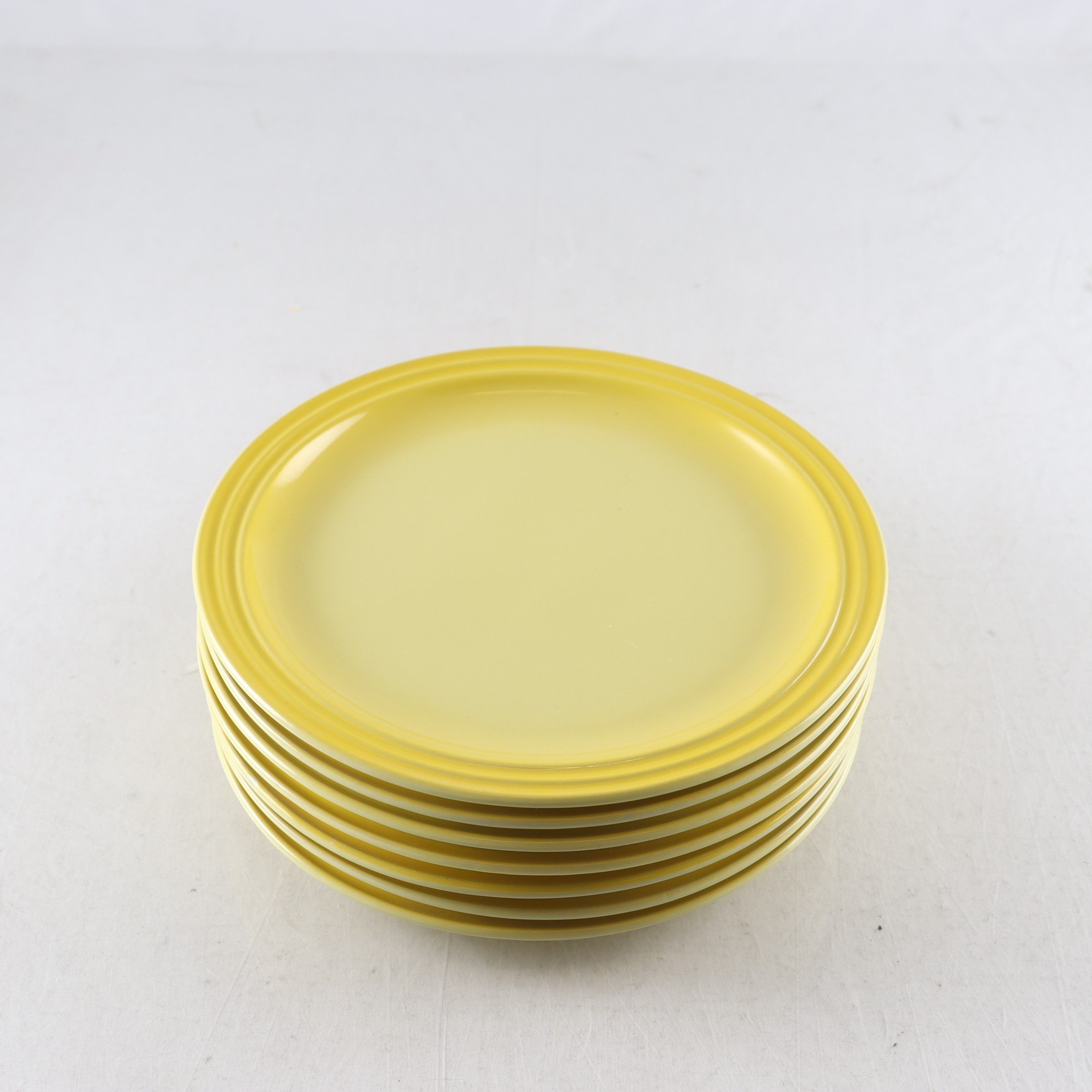 Tallrikar, gula, Le Creuset. Samfraktas ej.