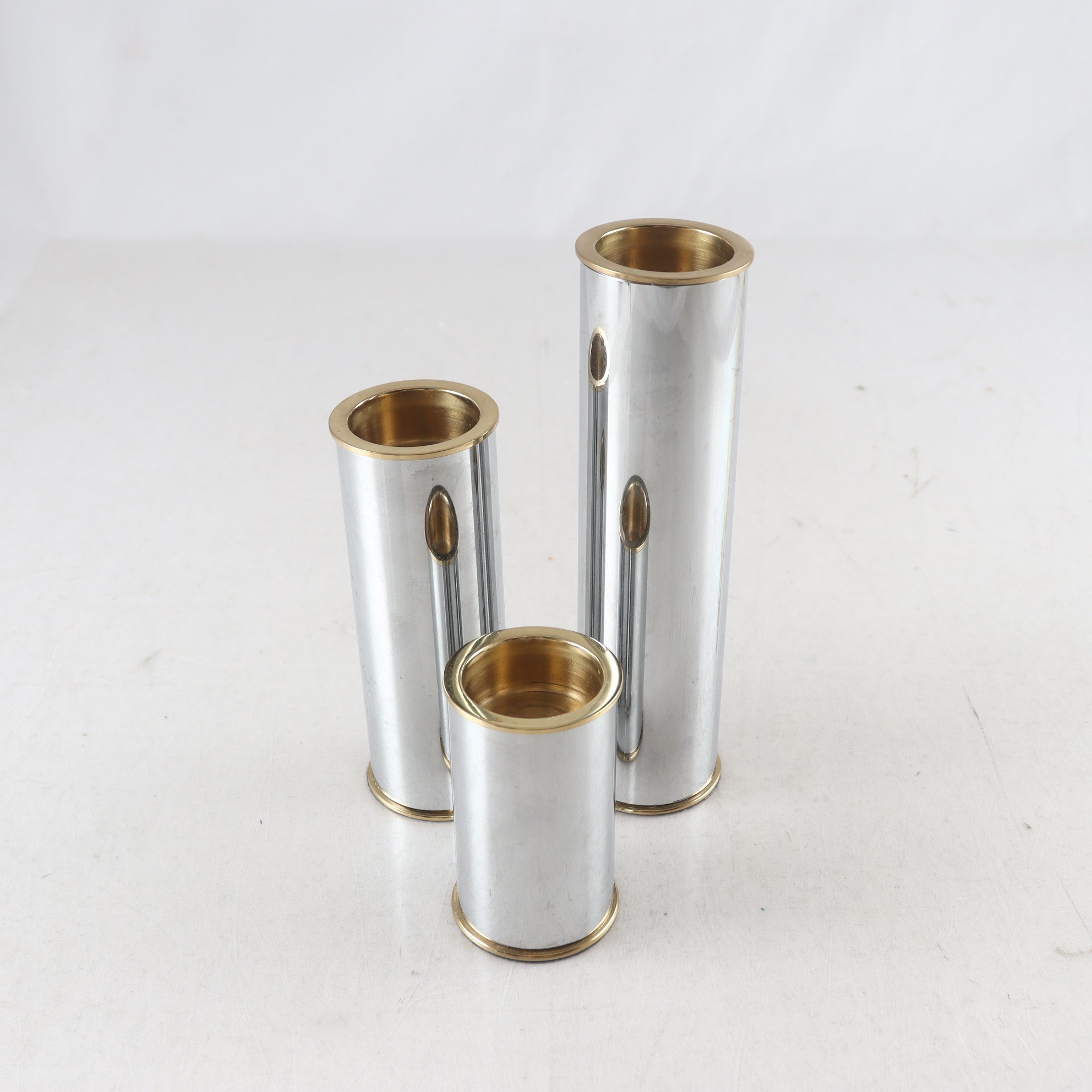 Ljusstakar, Staffan Englesson, kromad metall och mässing, 3 st.