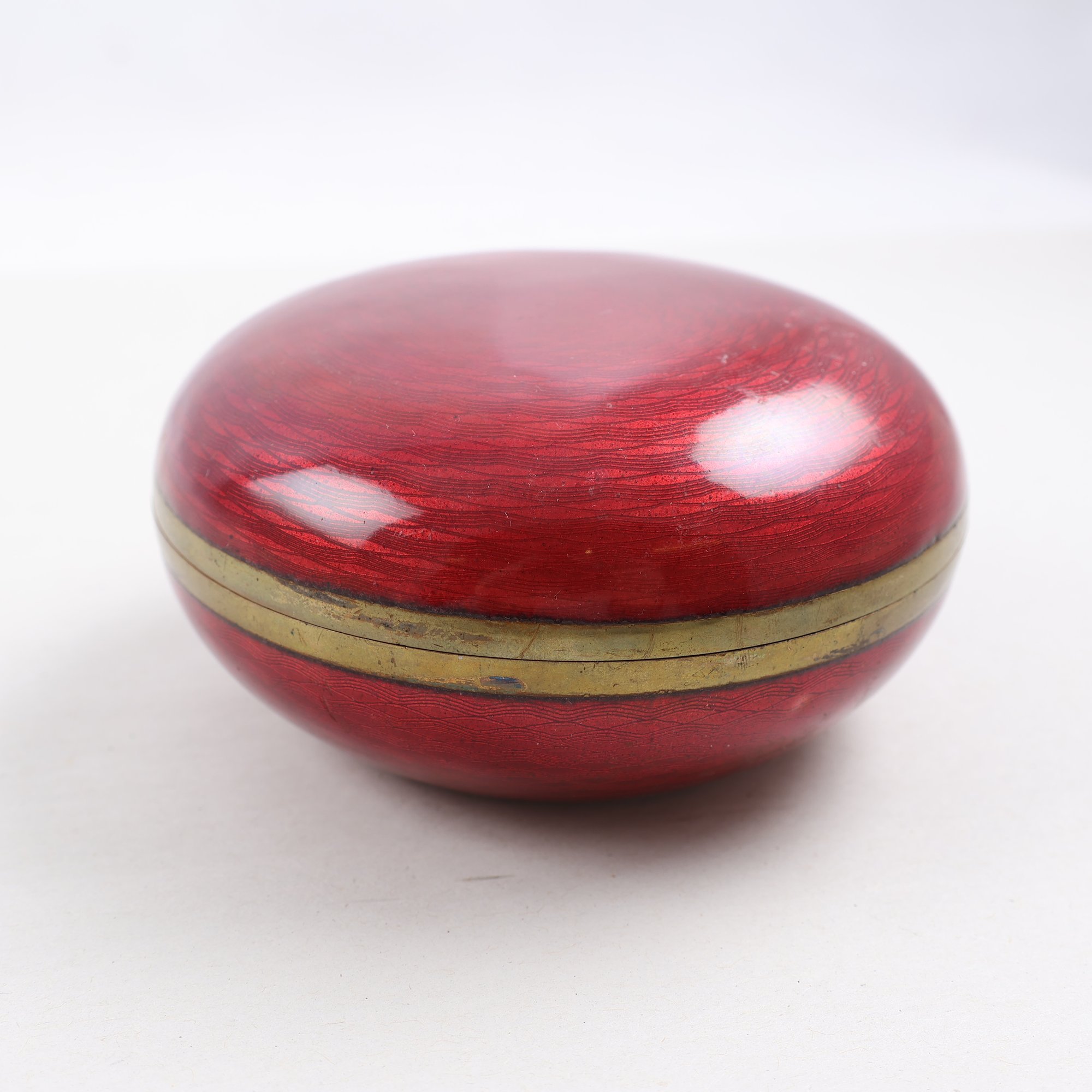 Lockburk, emalj, 1900-tal