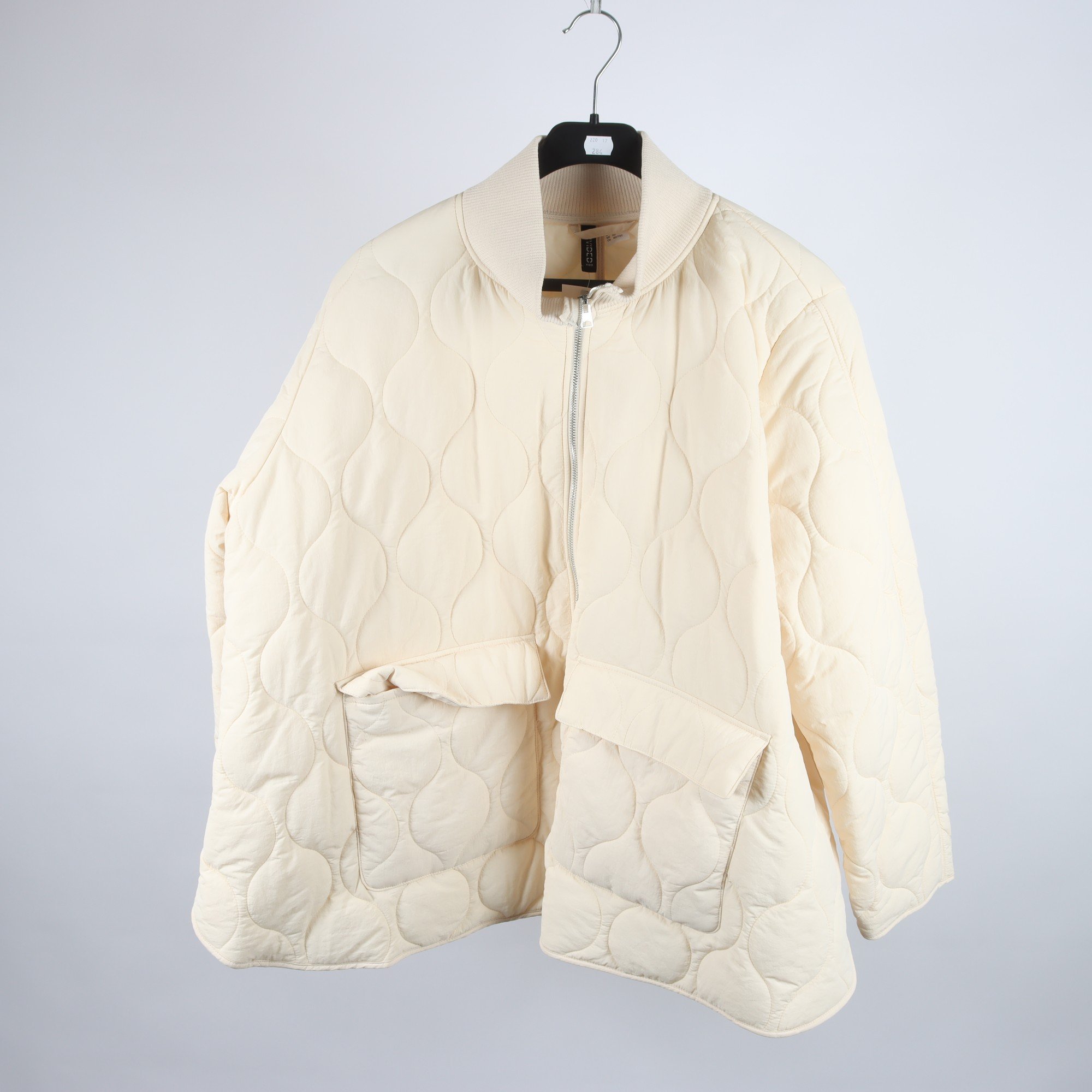 Jacka, Divided, beige, quiltad, stl. XL.